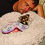man, sleeping, dog, puppy, blanket, couch, resting, cozy, indoor, fur, pet, cute, comfort, relaxation, face, human, animal, snuggling, soft, warm