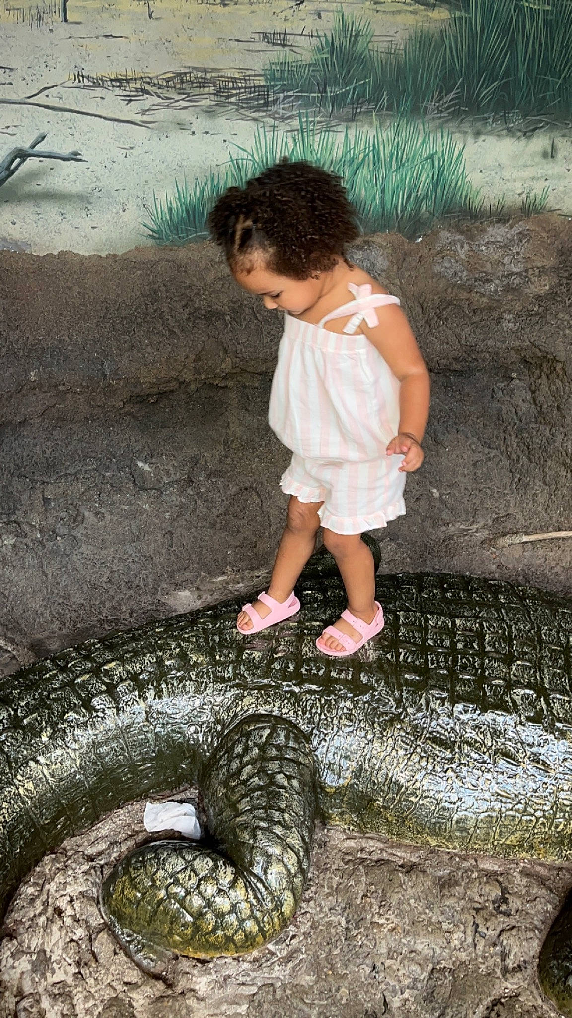 Izzy is registered to the contest to win money with this photo: automotive_tire, baby_toddler_clothing, flash_photography, fun, grass, happy, human_leg, leg, nature, people_in_nature, person, photograph, reptile, scaled_reptile, serpent, shorts, snake, tail, terrestrial_animal, toddler