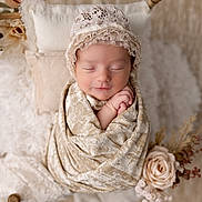 Emersyn is registered to the contest to win money with this photo: newborn, baby, sleeping, wrapped, blanket, lace_bonnet, pillow, flower, beige, soft_texture, cozy, innocence, peaceful, portrait, child, cute, rest, studio_photo, delicate, flowers