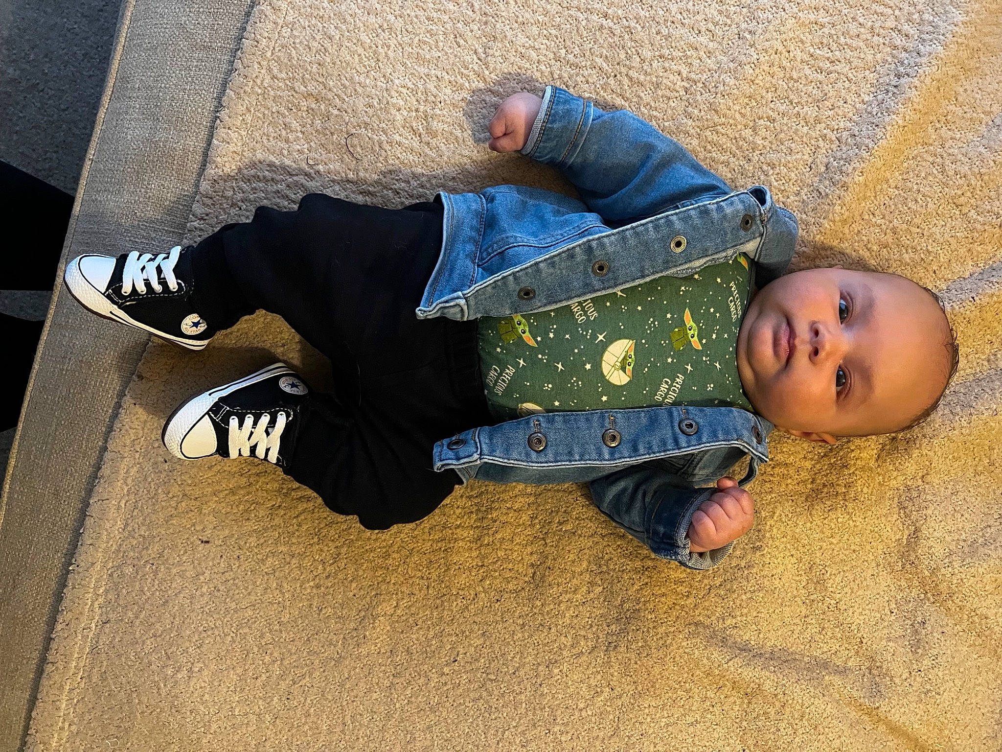 Easton is registered to the contest to win money with this photo: asphalt, baby, baby_toddler_clothing, child, comfort, floor, flooring, foot, fun, headgear, human_leg, leg, pattern, person, road_surface, shadow, sitting, sleeve, toddler, tree
