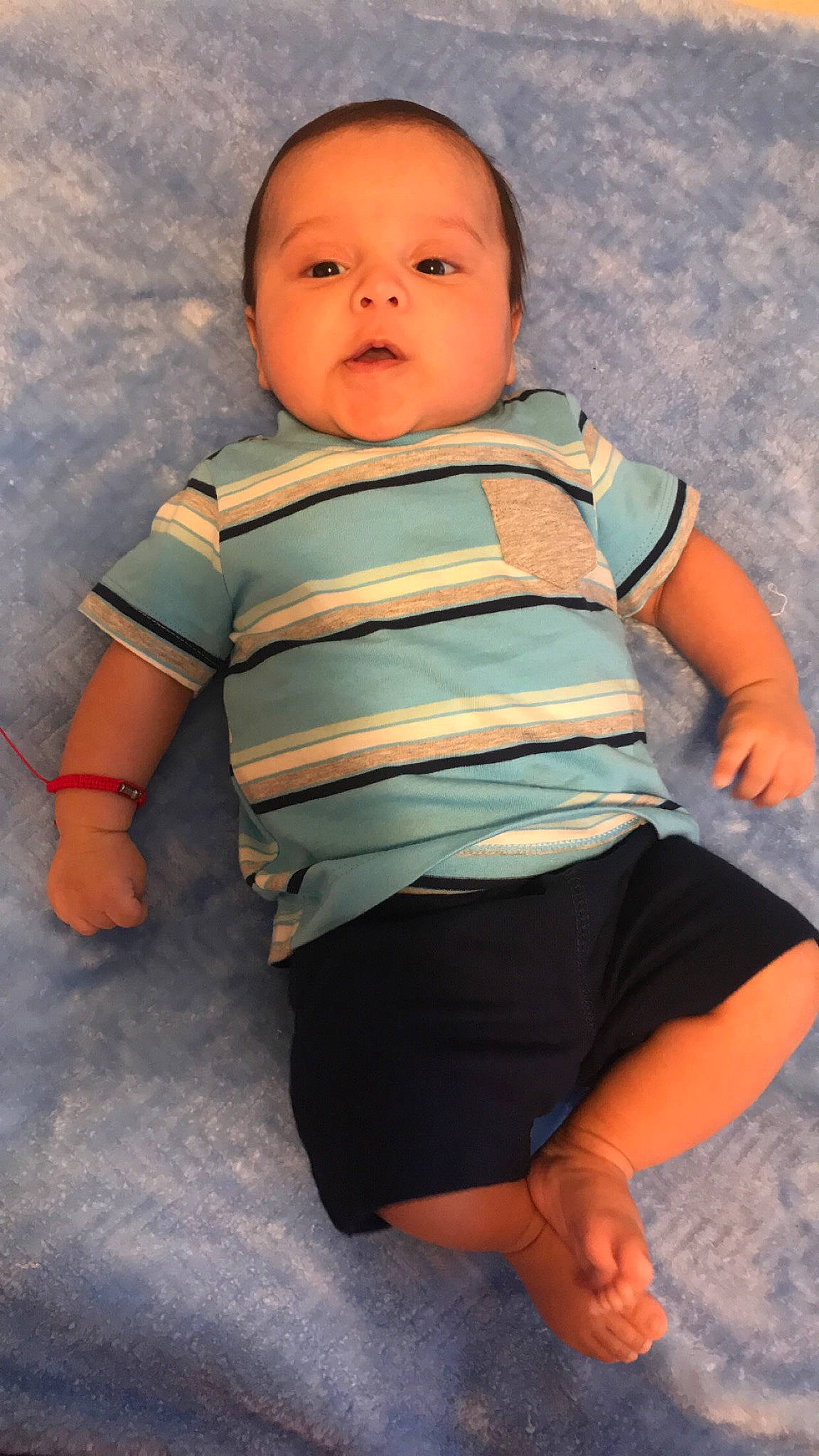 Azriel is registered to the contest to win money with this photo: baby, baby_toddler_clothing, cheek, child, collar, comfort, cool, eye, face, finger, gesture, happy, head, nose, orange, person, skin, sleeve, standing, t_shirt