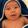 Hadley is registered to the contest to win money with this photo: baby, infant, face, eyes, smile, skin, towel, blue_towel, wrapped, cute, child, closeup, portrait, newborn, soft_texture, warmth, expression, indoors, human, happy