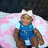 Italy Rose joined the competition — help win amazing prizes! baby, smiling, denim_overalls, headband, bow, cushion, pink, white, tie_dye, sitting, infant, cute, happy, indoors, person, clothing, footwear, sock, face, portrait
