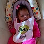 Aliyah is registered to the contest to win money with this photo: baby, infant, pink_outfit, bib, hair_bow, cushion, floral_pattern, seat, child, newborn, portrait, clothing, face, cute, indoor, resting, soft_toy, baby_bed, adorable, smiling
