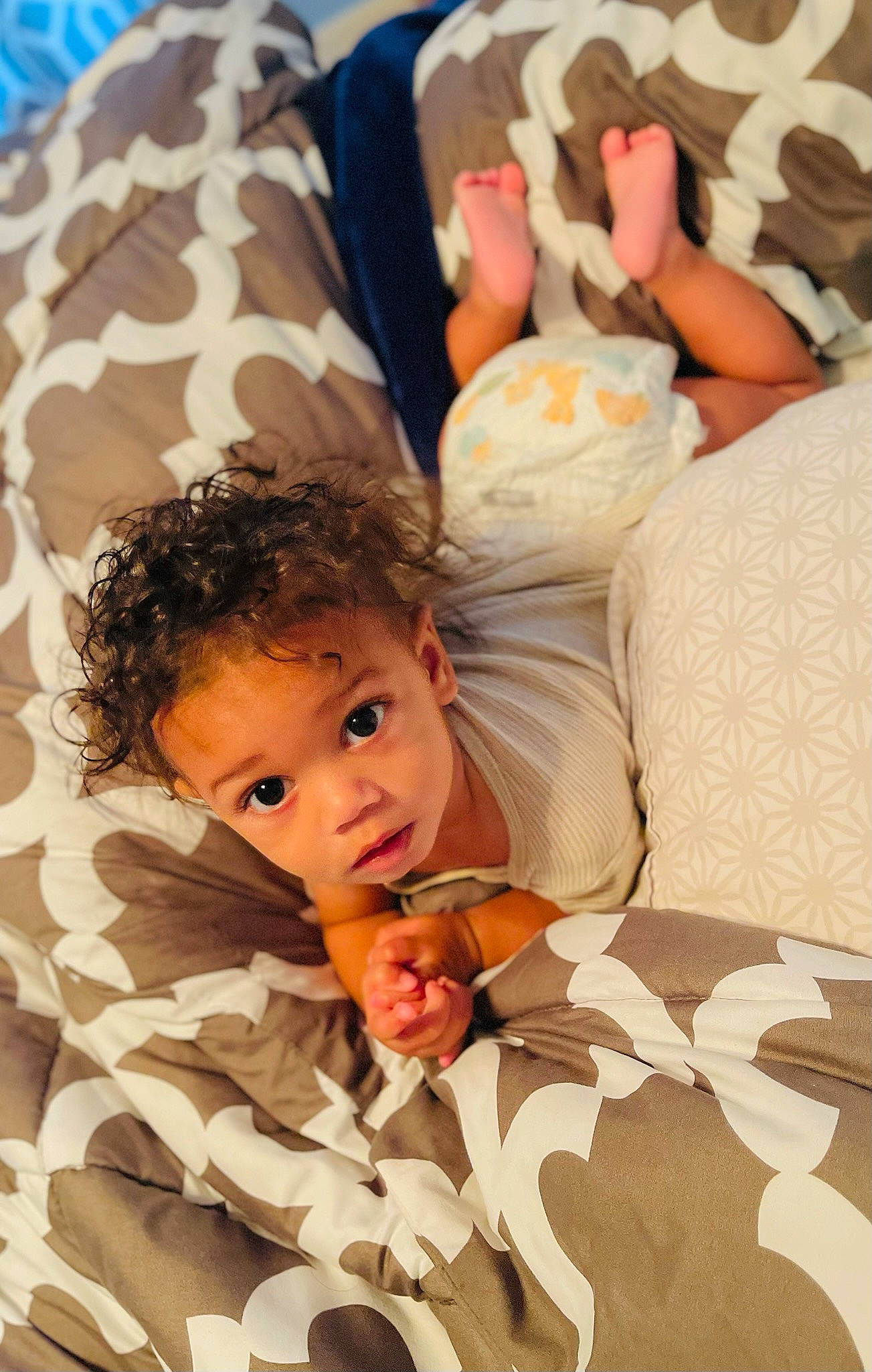 Kayden is registered to the contest to win money with this photo: baby, bed, bed_sheet, bedding, bedtime, child, comfort, fun, gesture, happy, human, leisure, linens, pattern, people_in_nature, person, room, sleep, surprise, textile
