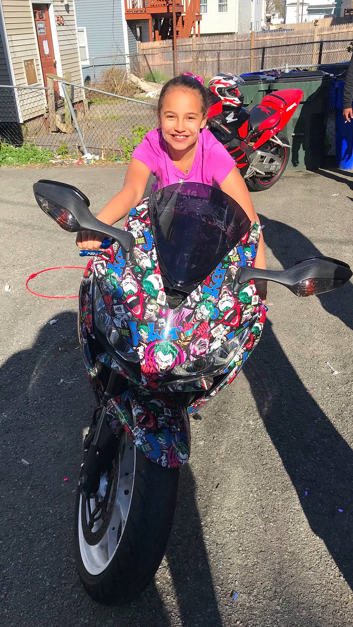 Kayda is registered to the contest to win money with this photo: asphalt, auto_part, automotive_tire, automotive_wheel_system, bicycle_accessory, bicycle_wheel, event, fashion_accessory, fun, joy, magenta, motor_vehicle, pattern, person, pink, recreation, shoe, smile, spoke, street_fashion