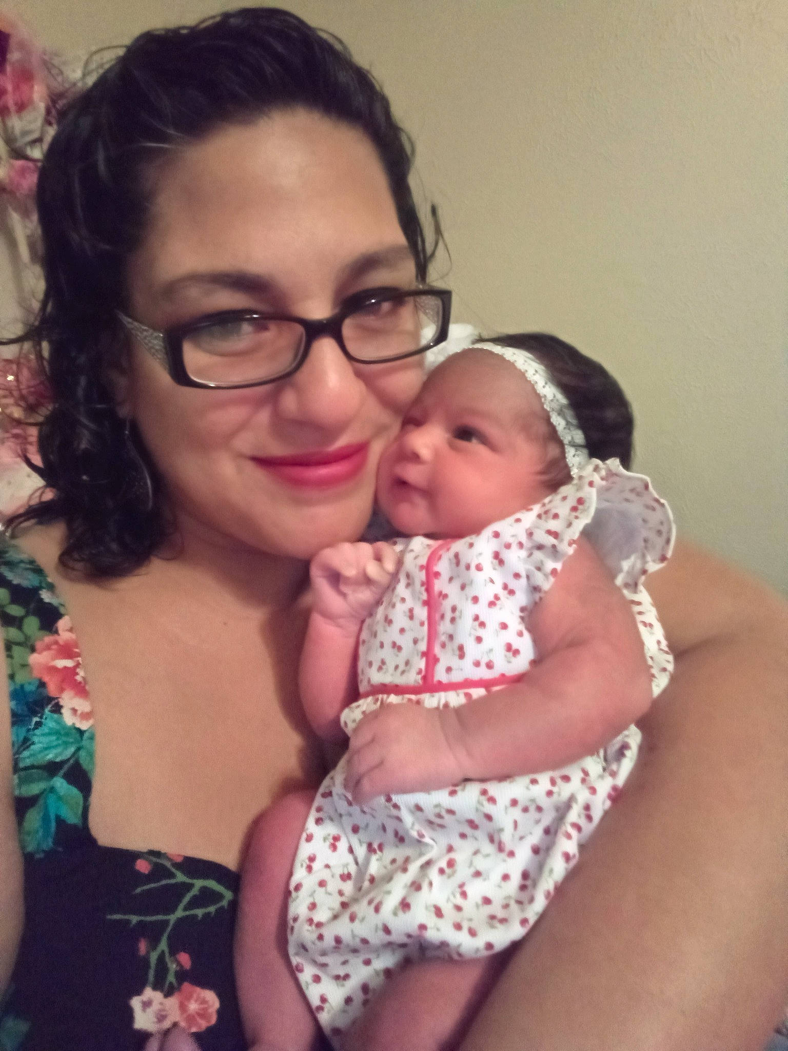 Amani is registered to the contest to win money with this photo: arm, baby, cheek, eye, eyewear, facial_expression, finger, gesture, glasses, happy, head, headwear, iris, joy, lip, mouth, neck, organ, person, shoulder