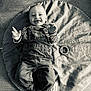 Ayden participe au concours pour gagner de l'argent avec cette photo : baby, infant, smiling, tongue_out, overalls, striped_shirt, play_mat, milestone_blanket, numbers, months, weeks, toy_ring, denim, lying_down, monochrome, portrait, happy, cute, hands, feet