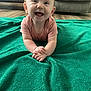 baby, blanket, child, clothing, couch, cute, eyes, face, floor, green_blanket, hands, happy, indoor, infant, person, portrait, short_sleeve, skin, smile, toddler