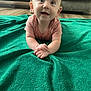 Nova joined the competition — help win amazing prizes! baby, blanket, child, clothing, couch, curious, cute, eyes, face, floor, green_blanket, hands, happy, indoors, infant, person, portrait, smiling, toddler, wooden_floor