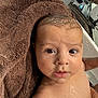baby, infant, wet_skin, towel, bath, face, eyes, mouth, skin, head, curious, expression, closeup, child, water_droplets, indoors, human, person, portrait, newborn
