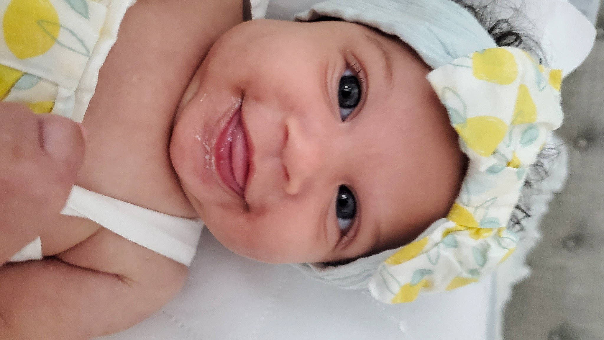 Sorraya is registered to the contest to win money with this photo: baby, baby_toddler_clothing, cheek, child, close_up, eye, eyebrow, eyelash, face, facial_expression, fashion_accessory, gesture, happy, headwear, iris, joy, lip, mouth, nose, person