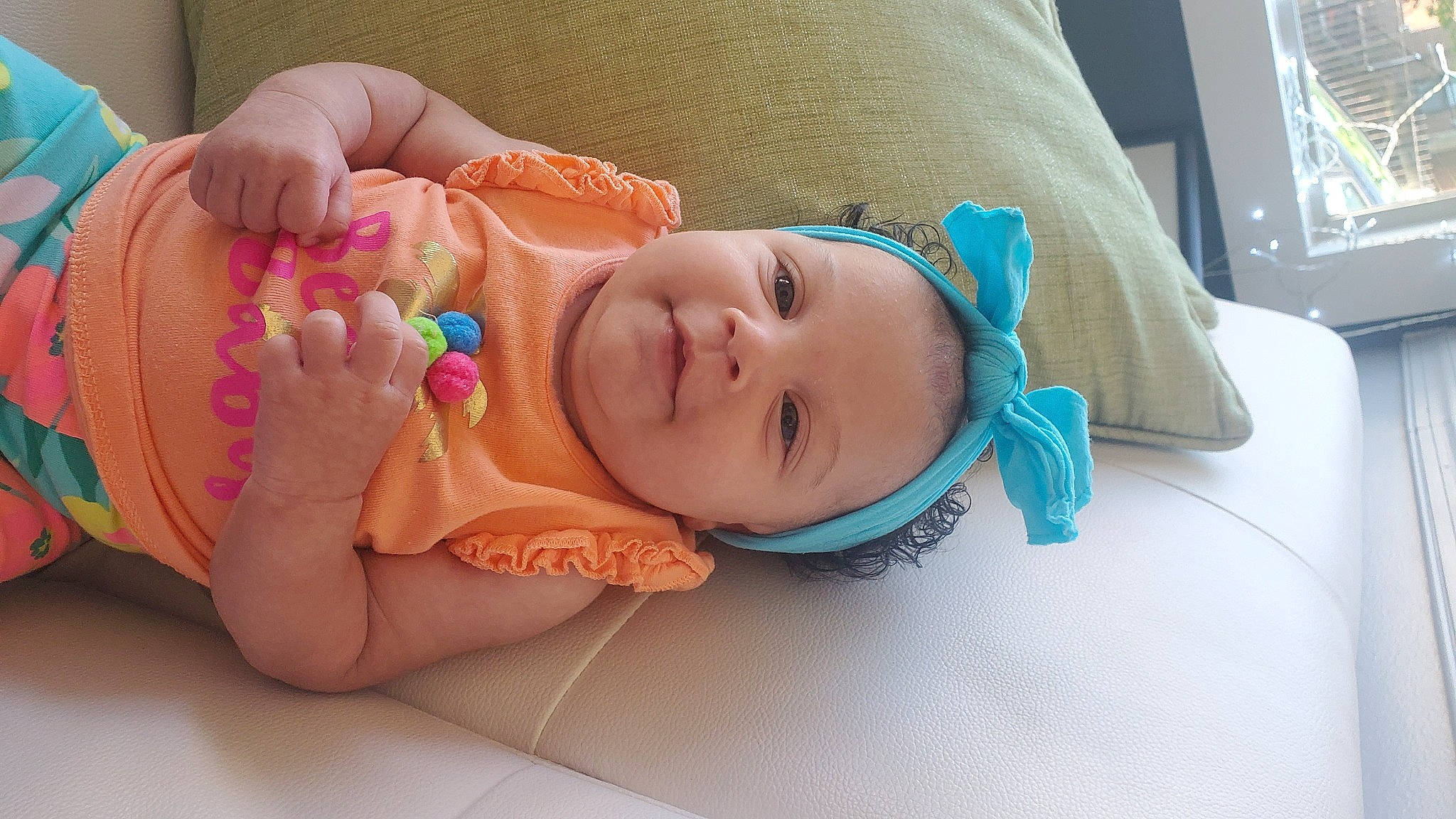 Sorraya is registered to the contest to win money with this photo: arm, baby, baby_toddler_clothing, cheek, child, comfort, eyelash, facial_expression, finger, gesture, happy, iris, mouth, neck, nose, person, product, skin, smile, thumb