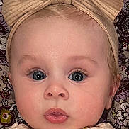 Xana joined the competition — help win amazing prizes! baby, child, face, headband, bow, blue_eyes, cardigan, clothing, cute, expression, floral_background, infant, looking_at_camera, person, portrait, sitting, skin, young_child, indoors, closeup
