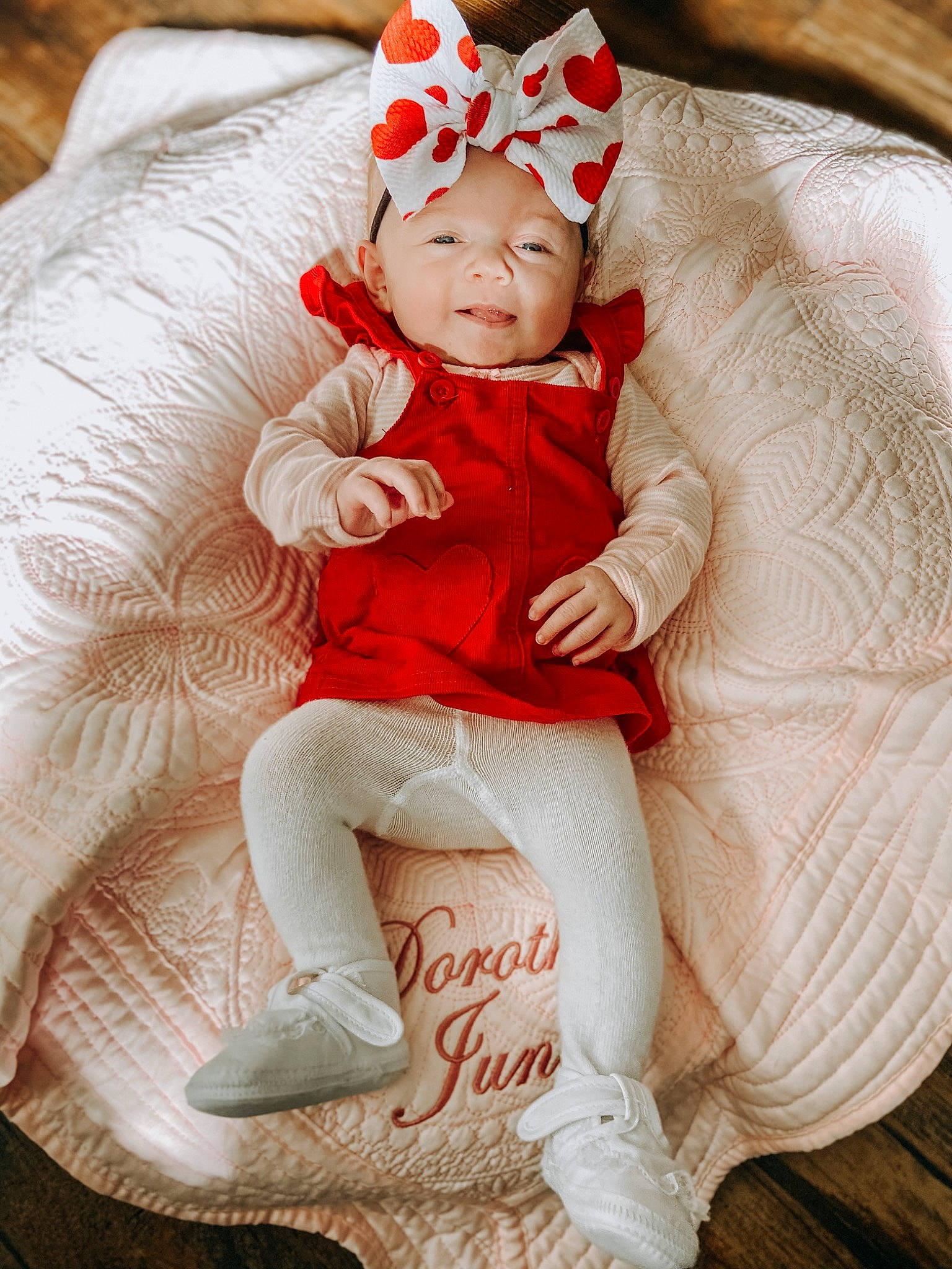 Dorothy is registered to the contest to win money with this photo: baby, child, christmas, christmas_eve, ear, person, photography, red, sitting, skin, toddler