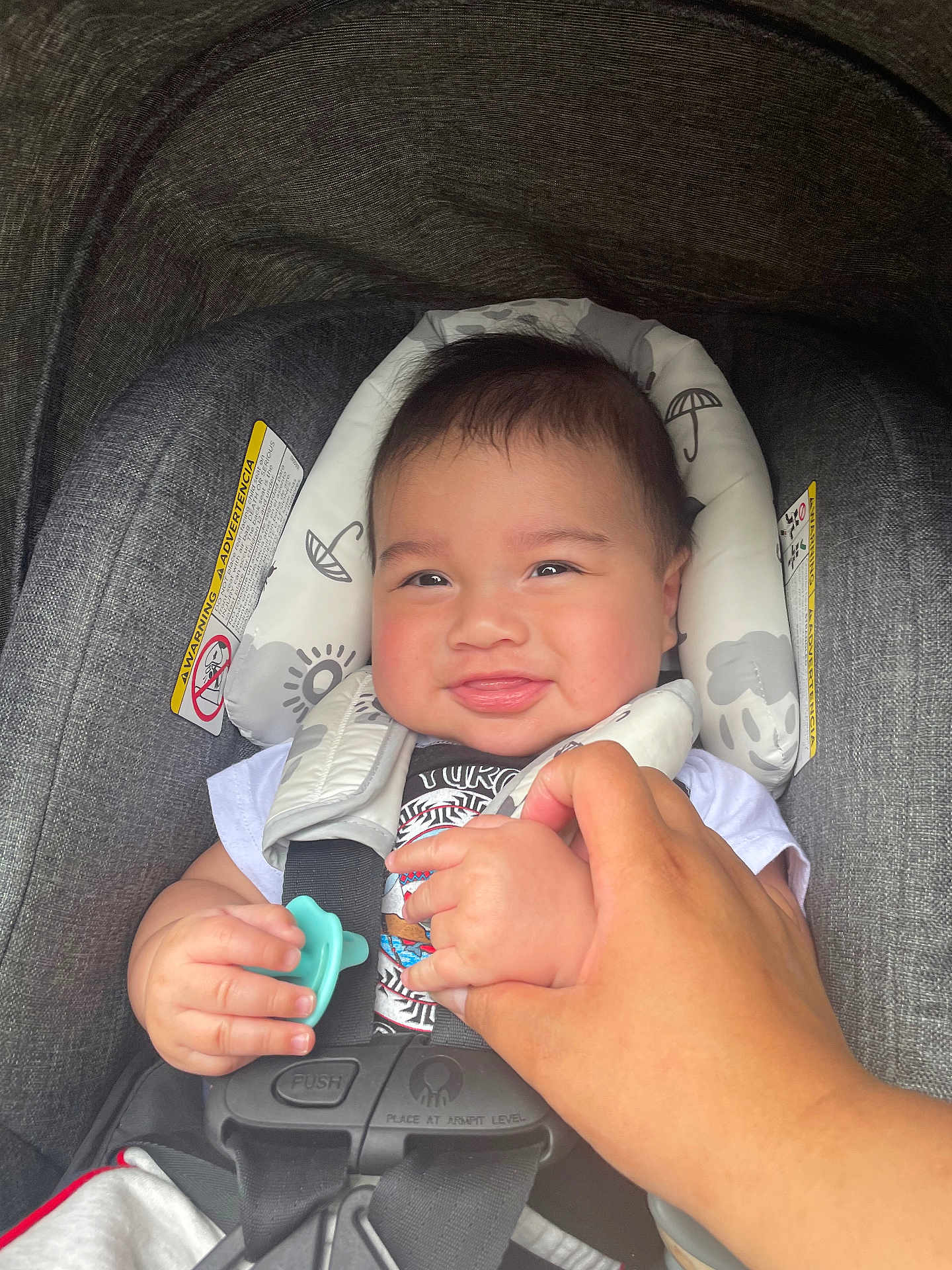 Soujah-Flint joined the competition — help win amazing prizes! baby, car_seat, infant, smile, hand, pacifier, child, safety_harness, clothing, person, cute, portrait, indoor, holding_hand, seat_belt, head_support, happy, toddler, skin, face