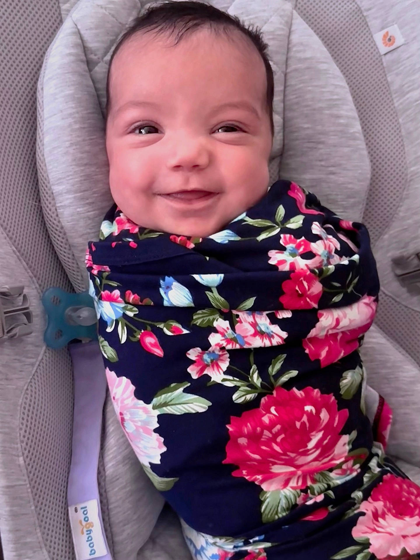 Everlee is registered to the contest to win money with this photo: baby, babylaughing, blanket, clothing, cushion, dress, face, flower, furniture, happy, head, homedecor, laughing, pattern, person, photography, plant, portrait, rose, smile