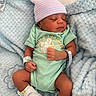 newborn, baby, sleeping, portrait, striped_hat, onesie, blanket, fluffy, blue, mint_green, hospital_bracelet, socks, infant, peaceful, indoors, close_up, resting, baby_clothing, soft_blanket, photography