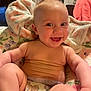 Eden is registered to the contest to win money with this photo: accessories, adult, baby, babylaughing, clothing, dress, face, female, happy, head, jewelry, laughing, newborn, person, photography, portrait, sitting, smile, towel, woman