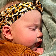 Eden is registered to the contest to win money with this photo: accessories, baby, bandana, blanket, bonnet, clothing, earring, face, happy, hat, head, headband, jewelry, newborn, person, photography, portrait, quilt, sleeping, yawning