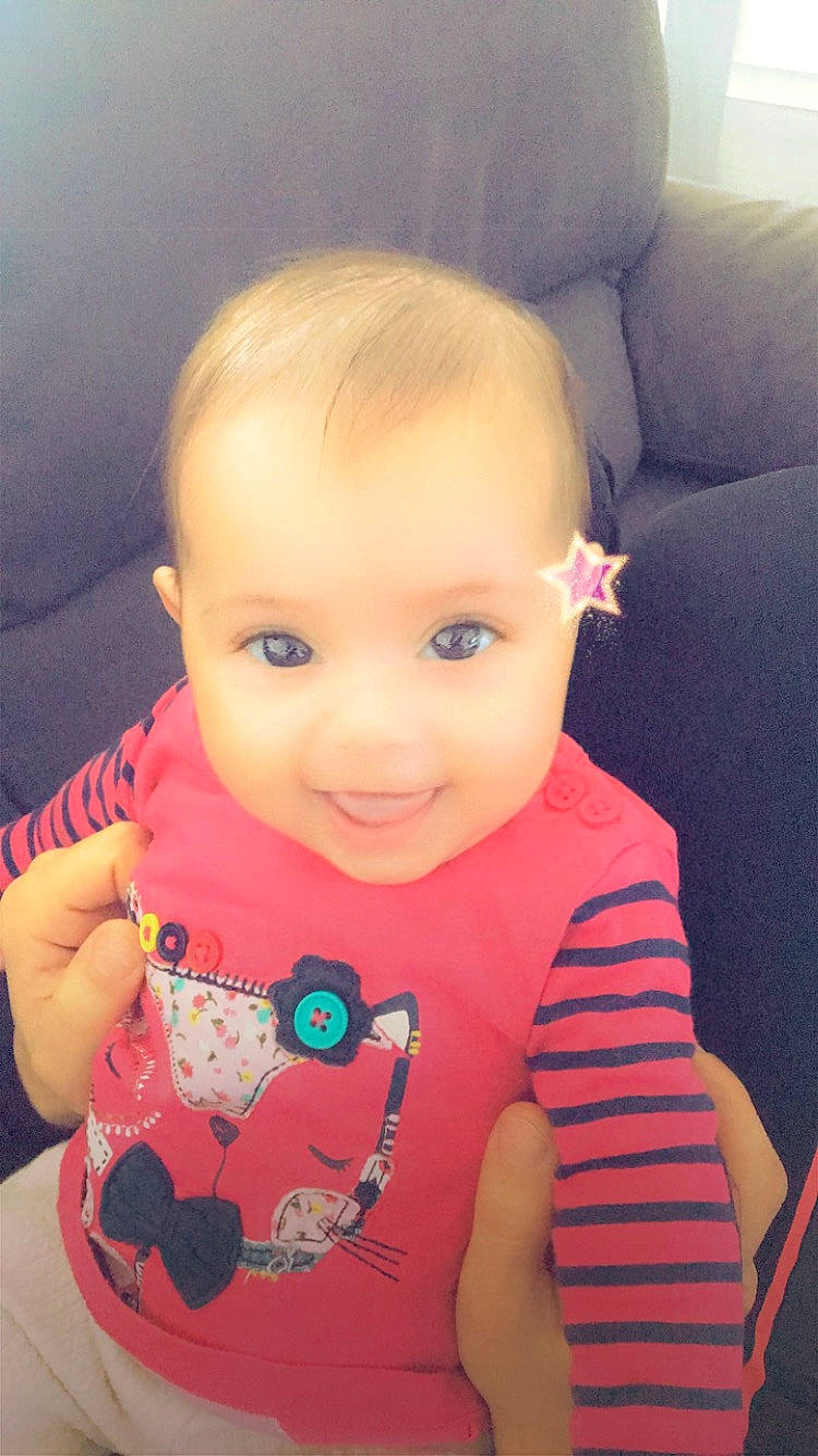 Naevia participe au concours pour gagner de l'argent avec cette photo : baby_toddler_clothing, cheek, chin, dress, eye, eyebrow, eyelash, face, forehead, happy, head, human_body, iris, joy, lip, mouth, neck, nose, person, skin