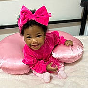 Kaymora is registered to the contest to win money with this photo: accessories, baby, clothing, couch, cream, cushion, dessert, dress, face, furniture, happy, head, homedecor, indoors, person, photography, pillow, portrait, purple, smile