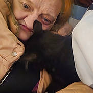 Zoom joined the competition — help win amazing prizes! affection, bedding, black_cat, blanket, cat, close_up, cozy, cuddling, ear, face, fur, hand, indoor, jacket, person, pet, portrait, senior_person, shoulder, wrinkles