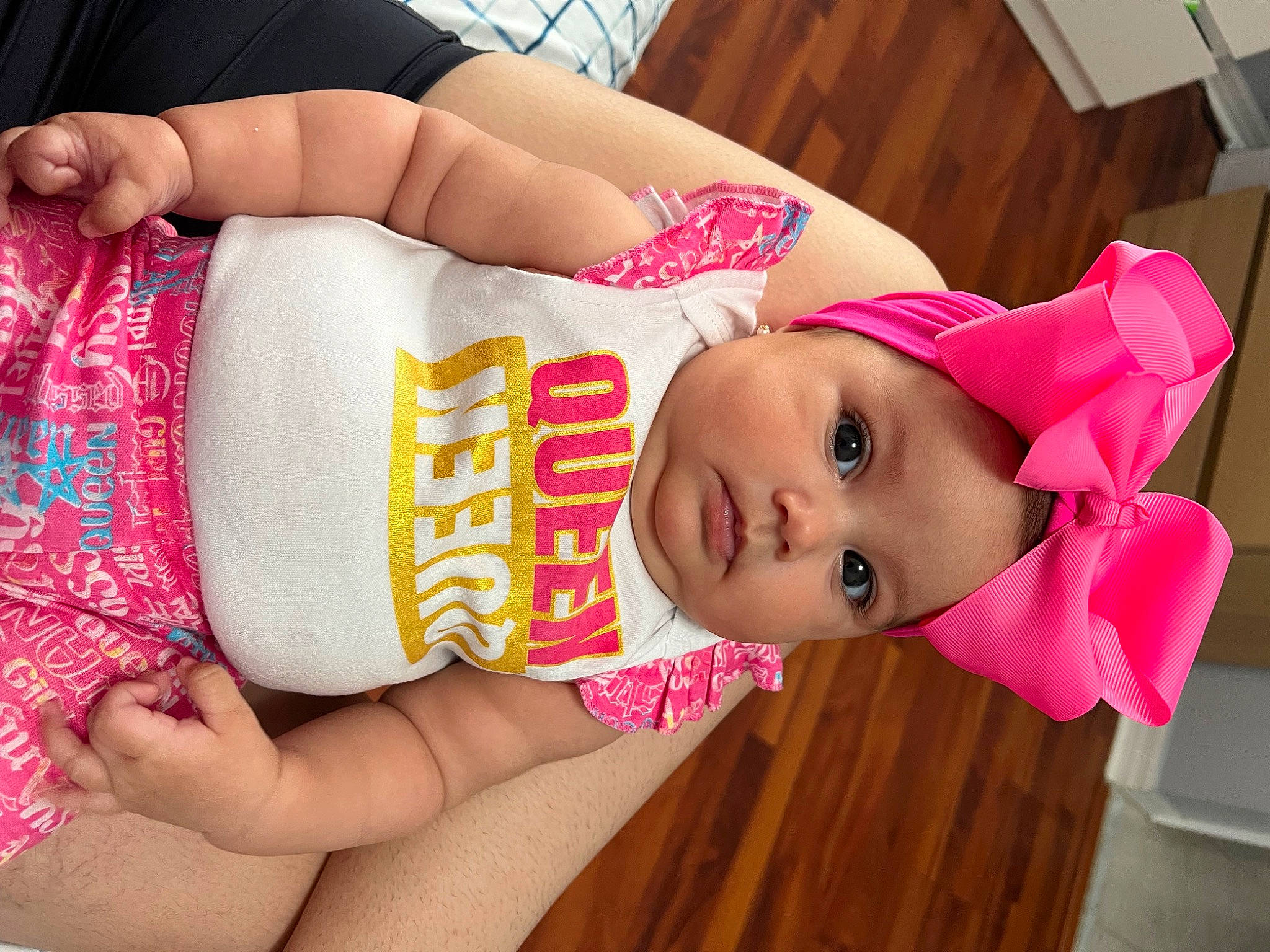 Aitana is registered to the contest to win money with this photo: abdomen, black_hair, cheek, chest, child, elbow, eyelash, finger, hand, happy, headwear, human_body, human_leg, joint, nail, person, pink, skin, textile, thigh