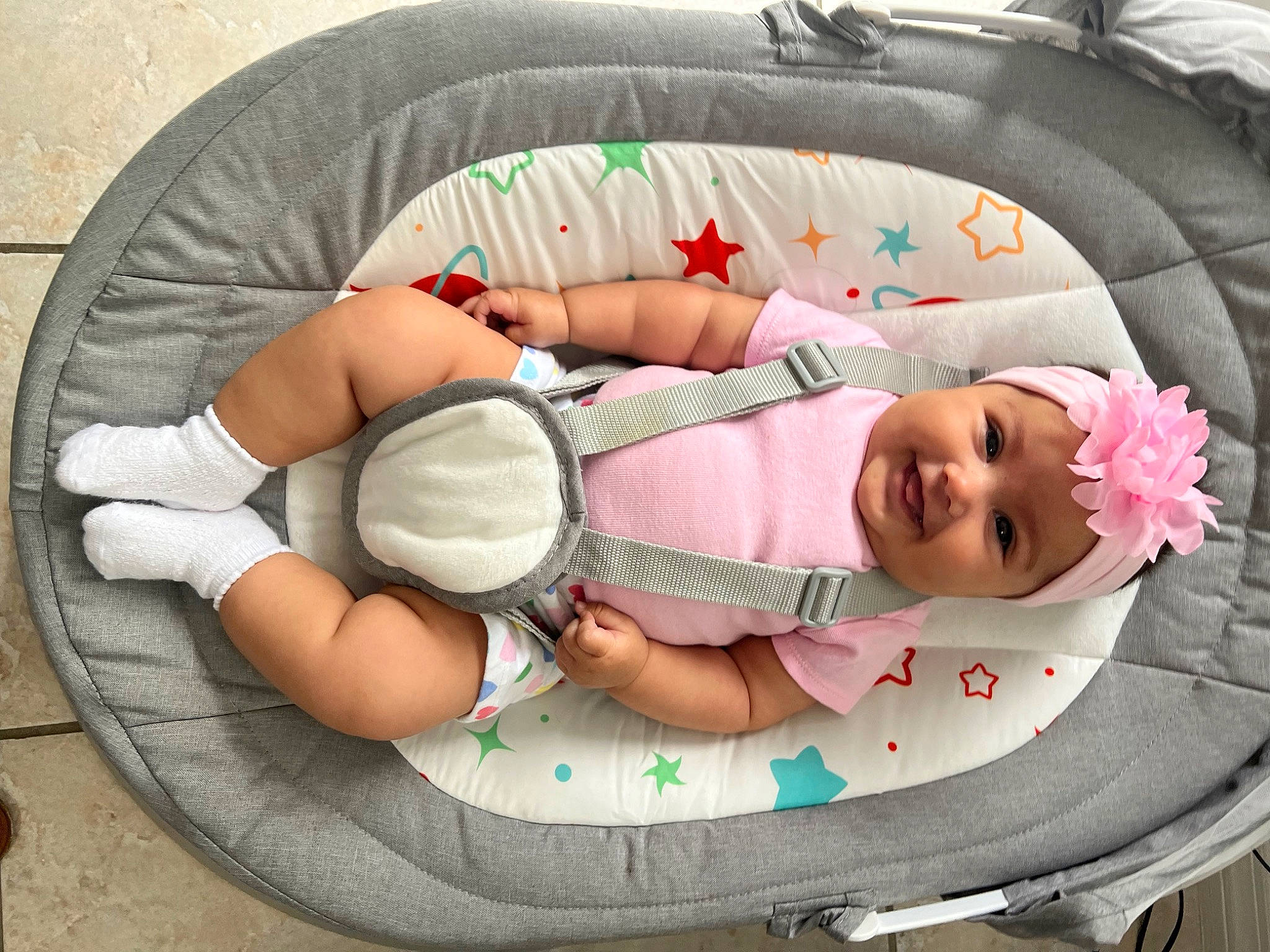 Aitana is registered to the contest to win money with this photo: baby, baby_carriage, baby_products, baby_safety, baby_sleeping, baby_toddler_clothing, child, circle, comfort, fashion_accessory, headwear, infant_bed, joy, linens, nap, pattern, person, pink, room, sitting