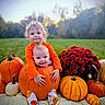 child, baby, pumpkin, orange_clothing, autumn, flowers, outdoor, grass, smile, hug, cute, fall, nature, garden, seasonal, siblings, playful, portrait, holiday, festive