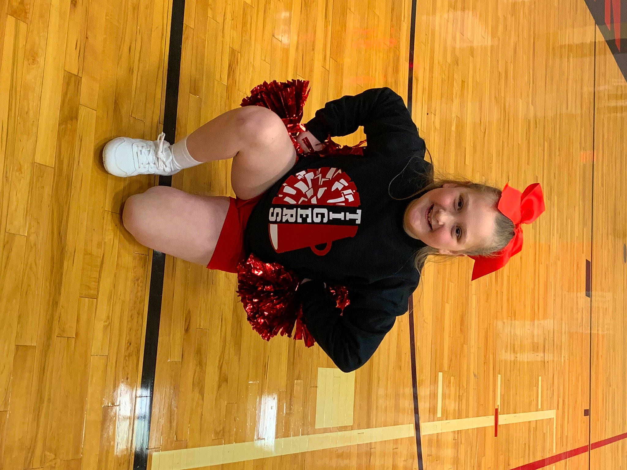 Alanna is registered to the contest to win money with this photo: elbow, flooring, hardwood, joy, knee, outdoor_shoe, person, sleeve, sportswear, thigh, varnish, walking_shoe, wood, wood_flooring, wood_stain, wrist