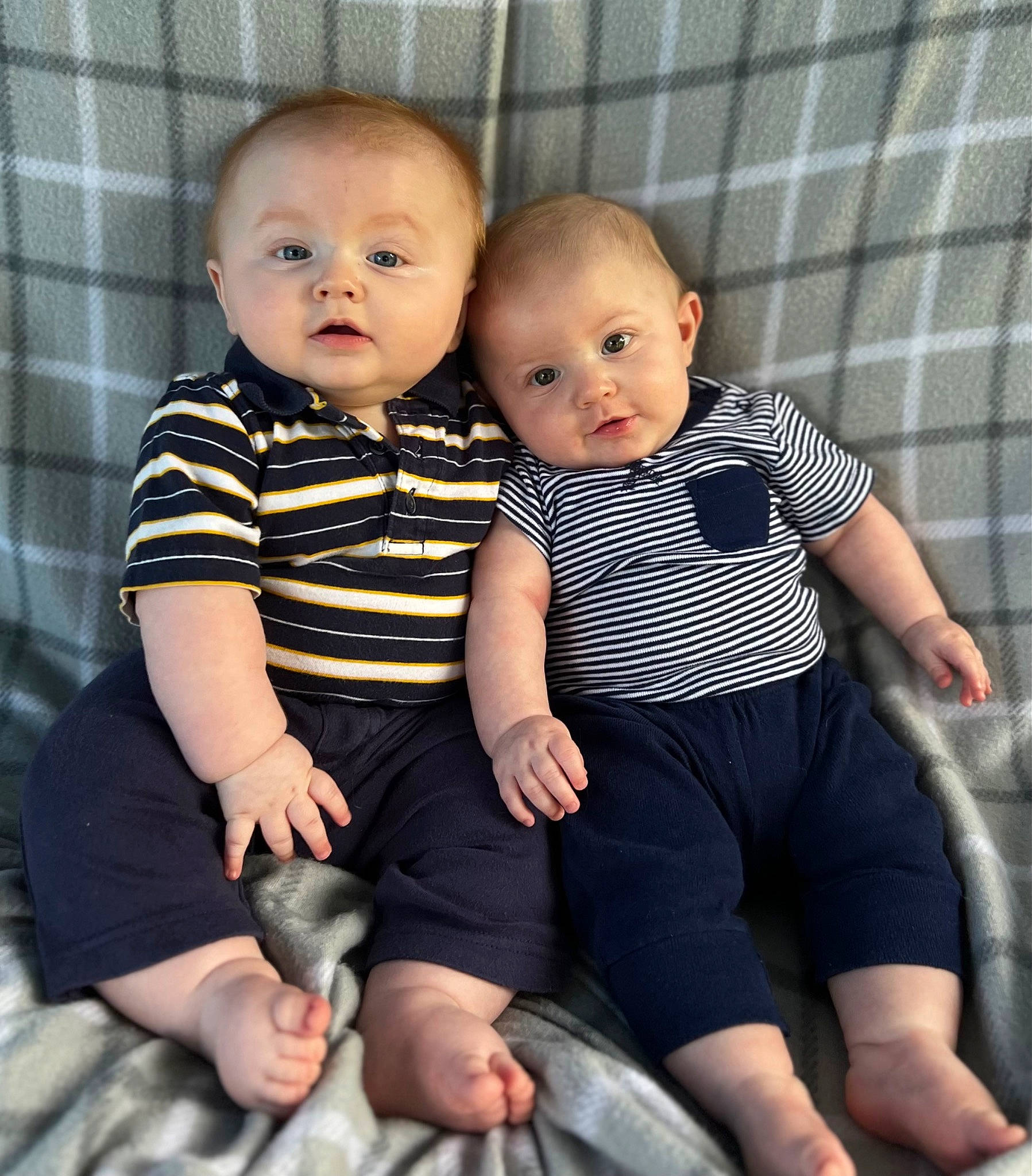 Zakari is registered to the contest to win money with this photo: abdomen, baby, baby_toddler_clothing, cheek, child, comfort, face, finger, flash_photography, fun, gesture, happy, iris, lap, pattern, person, sitting, skin, sleeve, thigh