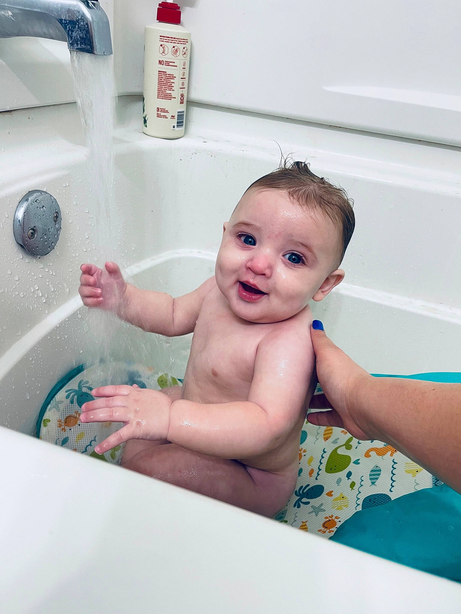Liam is registered to the contest to win money with this photo: baby, baby_bathing, bath_toy, bathing, bathroom, bathtub, child, fluid, fun, hand, happy, leisure, liquid, person, personal_care, plumbing, plumbing_fixture, skin, smile, toddler