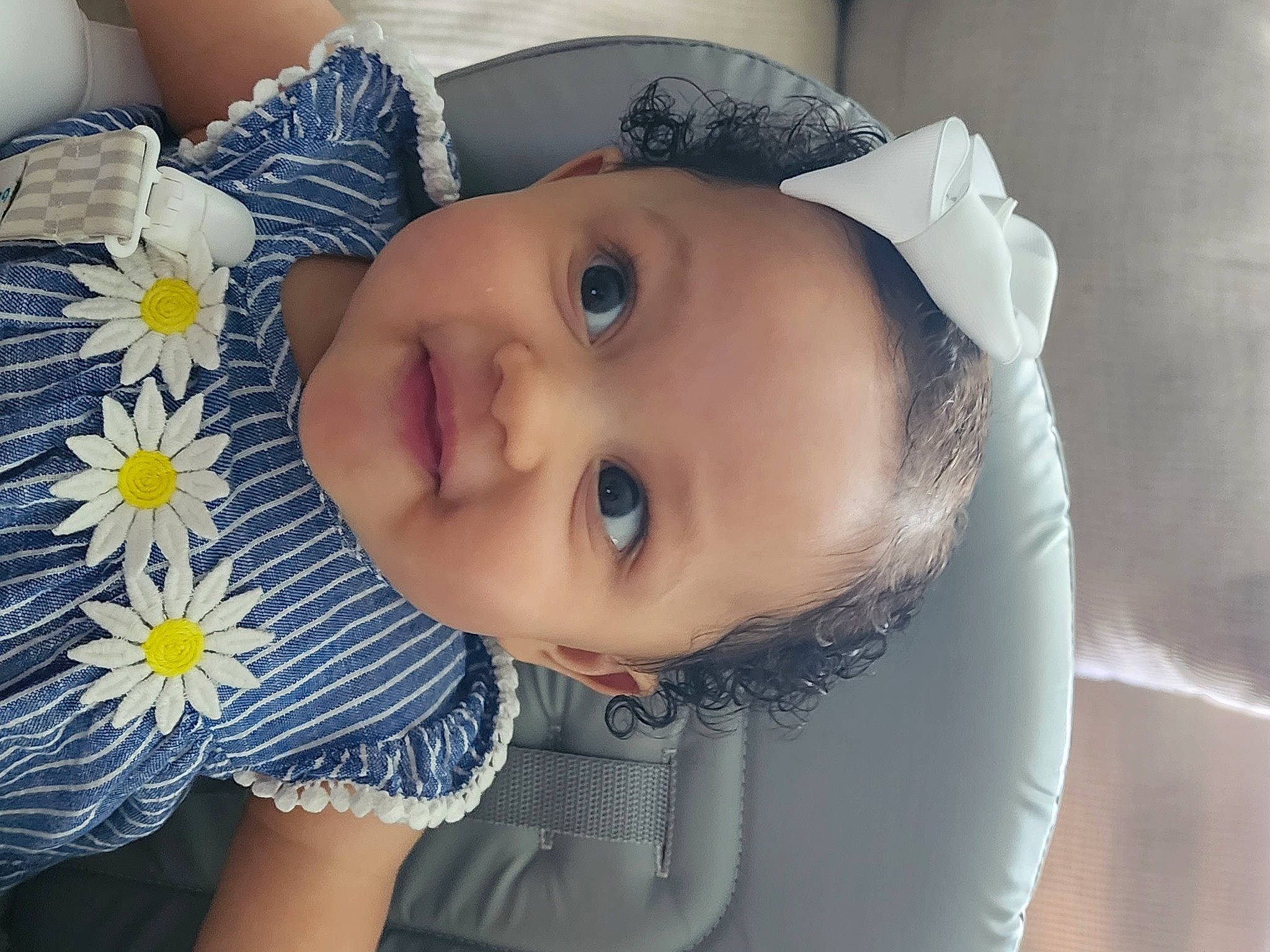 Nevaeh joined the competition — help win amazing prizes! azure, baby, baby_toddler_clothing, cheek, dress, eye, eyelash, facial_expression, happy, hat, headgear, iris, lip, nose, person, petal, plant, skin, smile, textile