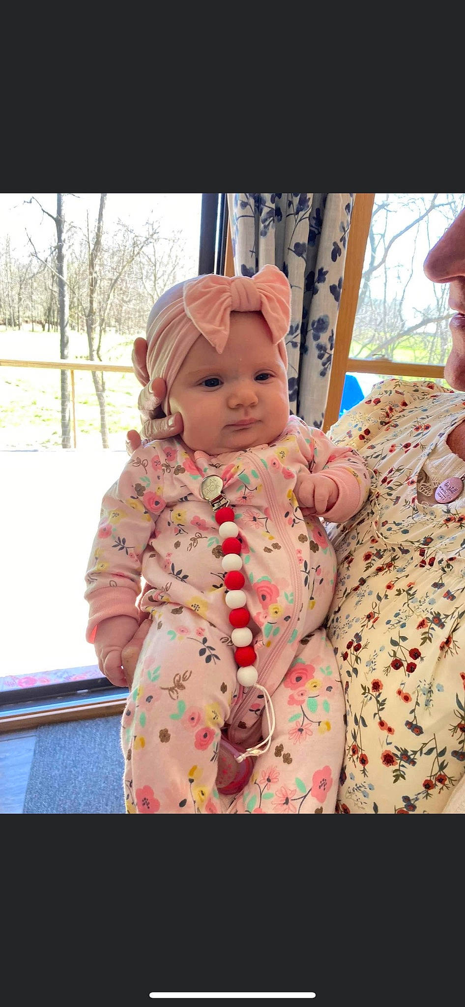 Camille is registered to the contest to win money with this photo: baby, baby_products, baby_toddler_clothing, cap, cheek, child, fun, happy, hat, headwear, interaction, pattern, peach, person, pink, sitting, skin, sleeve, snow, stuffed_toy