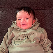 Sebastian joined the competition — help win amazing prizes! baby, child, smiling, hoodie, nike, pants, sitting, couch, happy, clothing, face, person, indoor, casual, comfortable, young, portrait, cute, infant, relaxed