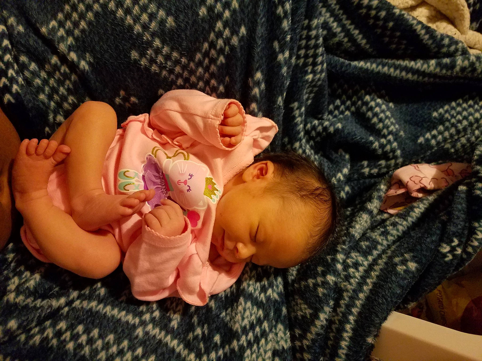 Lakota joined the competition — help win amazing prizes! baby, baby_products, baby_toddler_clothing, cheek, child, comfort, grass, hair, human_body, linens, nail, nap, pattern, person, room, sitting, skin, sleep, textile, thumb