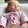 baby, sleeping, pink_clothing, minnie_mouse, blanket, red_hair, infant, cute, toddler, soft_texture, peaceful, indoors, pillow, child, portrait, closeup, resting, young, cozy, cute_outfit