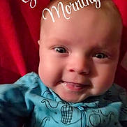 Andrew joined the competition — help win amazing prizes! baby, child, smile, blue_clothing, onesie, dinosaur_pattern, face, red_background, closeup, infant, happy, portrait, cute, morning, text_overlay, sun_emoji, expression, young_child, indoor, person