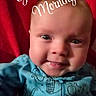 baby, child, smile, blue_clothing, onesie, dinosaur_pattern, face, red_background, closeup, infant, happy, portrait, cute, morning, text_overlay, sun_emoji, expression, young_child, indoor, person