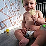 Hunter-James joined the competition — help win amazing prizes! toddler, child, diaper, floor, toy, headband, green, lollipop, ghost_shaped, indoor, baby, expression, bare_chest, foot, hand, candy, playful, home, wooden_floor, sitting