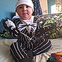 baby, child, costume, jack_skellington, nightmare_before_christmas, bed, bedding, clothing, hat, gloves, indoor, person, cute, sitting, toy, room, wall, door, coat, playful