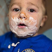 Hunter-James joined the competition — help win amazing prizes! baby, blue_jacket, chelsea_logo, child, closeup, clothing, cream, curious, expression, face, food, indoor, mess, messy, mouth_open, person, portrait, skin, toddler, yogurt