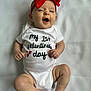 baby, infant, child, onesie, red_bow, headband, valentines_day_text, smile, happy, lying_down, white_background, chubby_legs, bare_feet, small_hands, portrait, newborn, cute, clothing, celebration, studio_photo