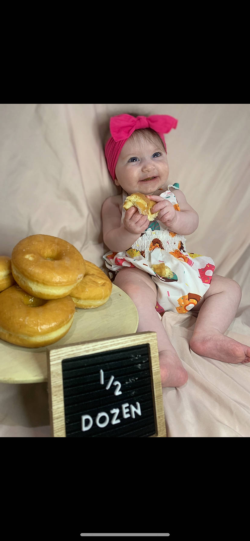 Everleigh is registered to the contest to win money with this photo: baby, baby_toddler_clothing, baked_goods, baking, cap, child, cooking, cuisine, dessert, finger_food, food, gluten, happy, headwear, ingredient, joy, junk_food, magenta, person, sitting