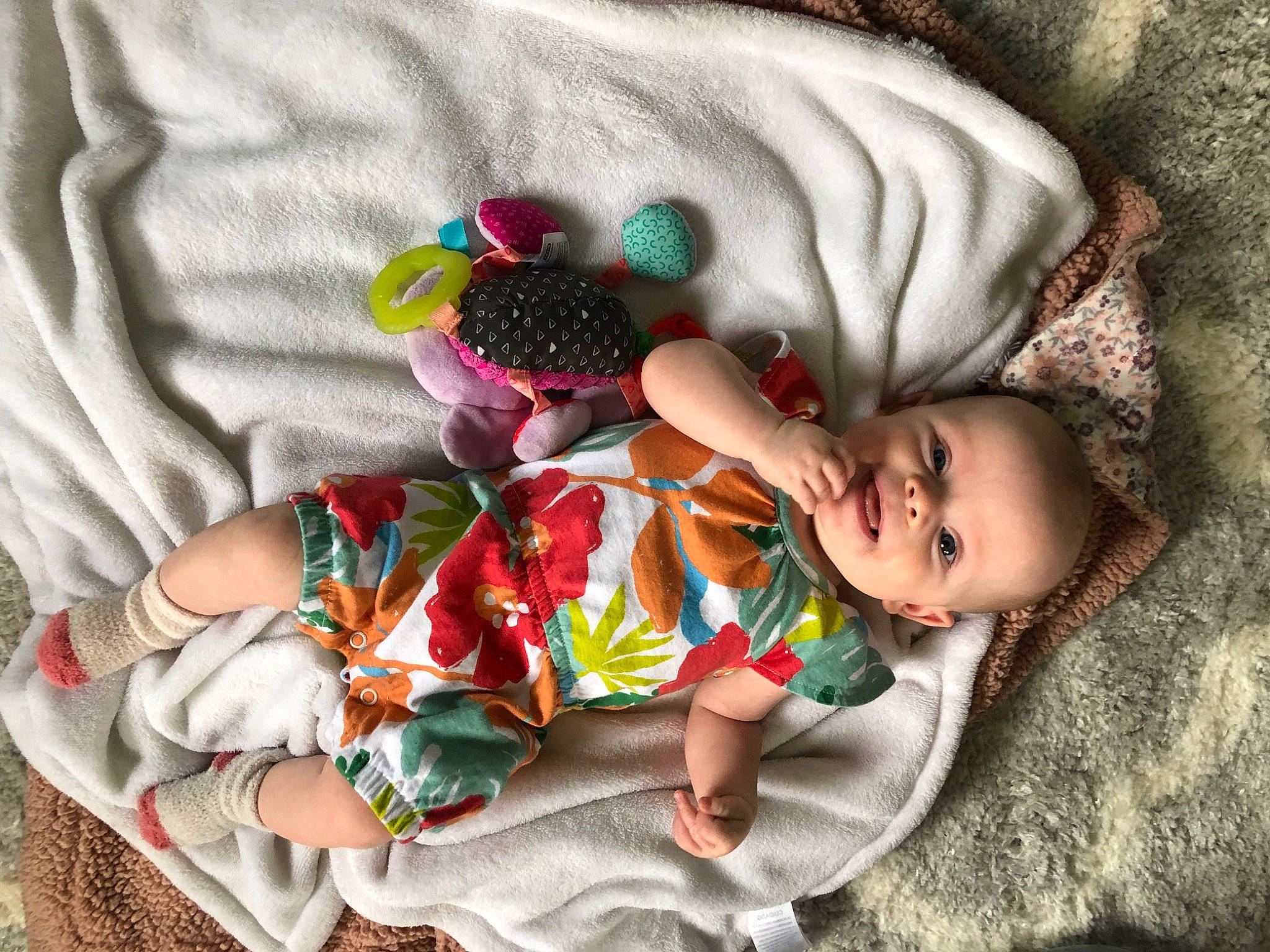 Annamarie is registered to the contest to win money with this photo: baby, baby_products, baby_sleeping, baby_toddler_clothing, child, comfort, finger, fun, grass, happy, human_body, linens, pattern, person, product, room, skin, sleeve, textile, toddler