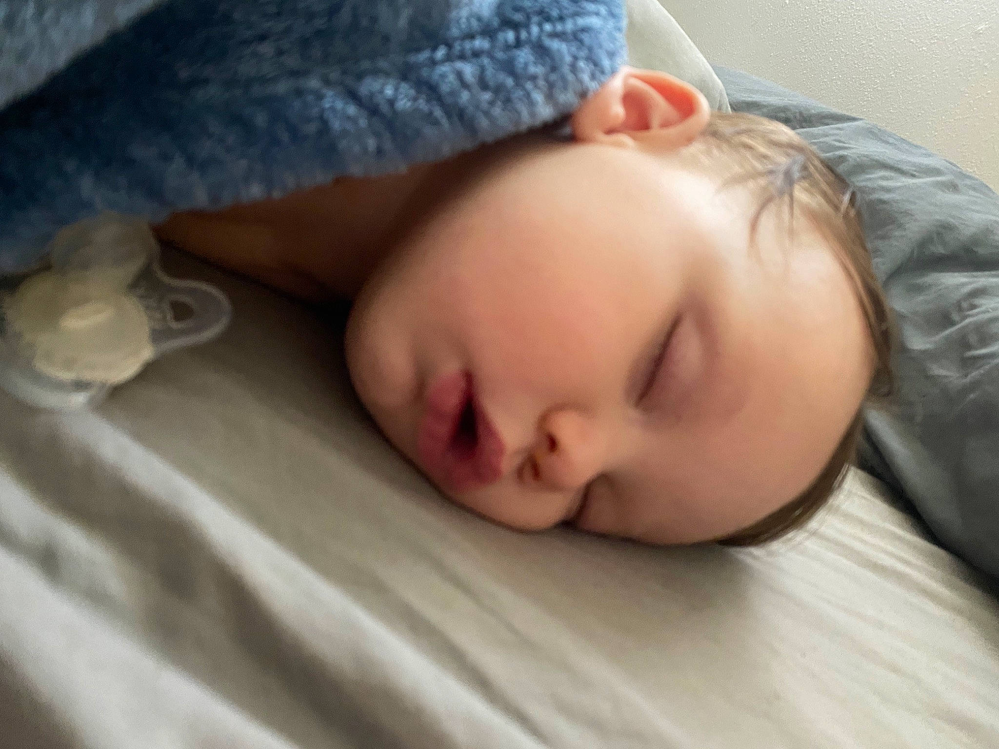Bradley is registered to the contest to win money with this photo: baby, baby_sleeping, baby_toddler_clothing, bedding, bedtime, blanket, cheek, child, comfort, flesh, linens, nap, nose, person, portrait_photography, room, skin, sleep, sleeve, toddler