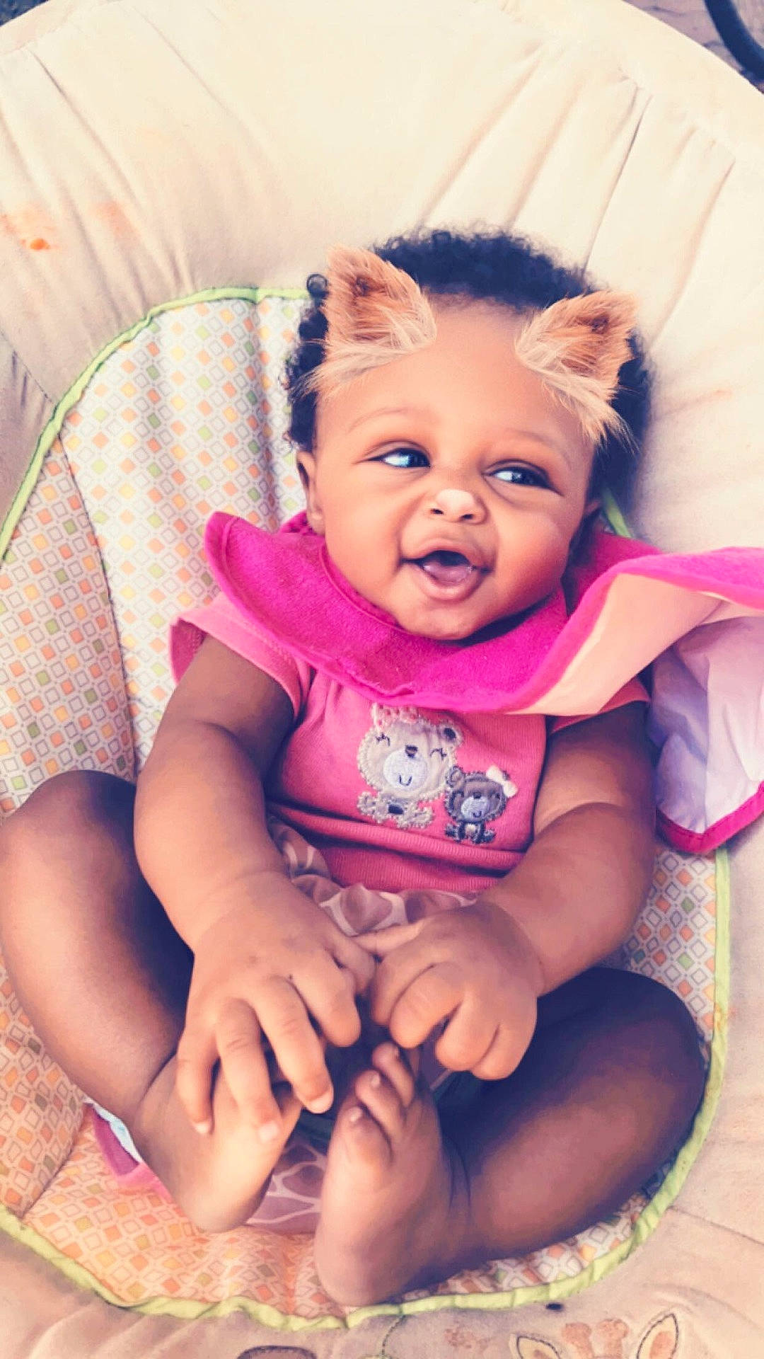 Faith is registered to the contest to win money with this photo: abdomen, cheek, child, finger, fun, girl, hand, happiness, head, human_hair_color, infant, iris, mouth, person, pink, product, sitting, skin, smile, toddler