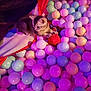 Onyx joined the competition — help win amazing prizes! ball_pit, balls, cat, clutching, colorful, cozy, cute, domestic_cat, feline, indoor, kitten, pastel_colors, pet, playful, purple_lighting, relaxing, small_animal, soft_light, toy, young_cat