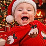 baby, child, smiling, santa_hat, christmas, holiday, festive, red_clothing, fireplace, christmas_tree, lights, decorations, wrapped_gifts, indoors, happy, cute, portrait, seasonal, celebration, cozy